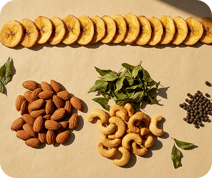 Banana chips, almonds, cashews and curry leaves arranged on a table