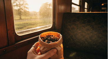Holding a cup of dry fruits on a morning commute